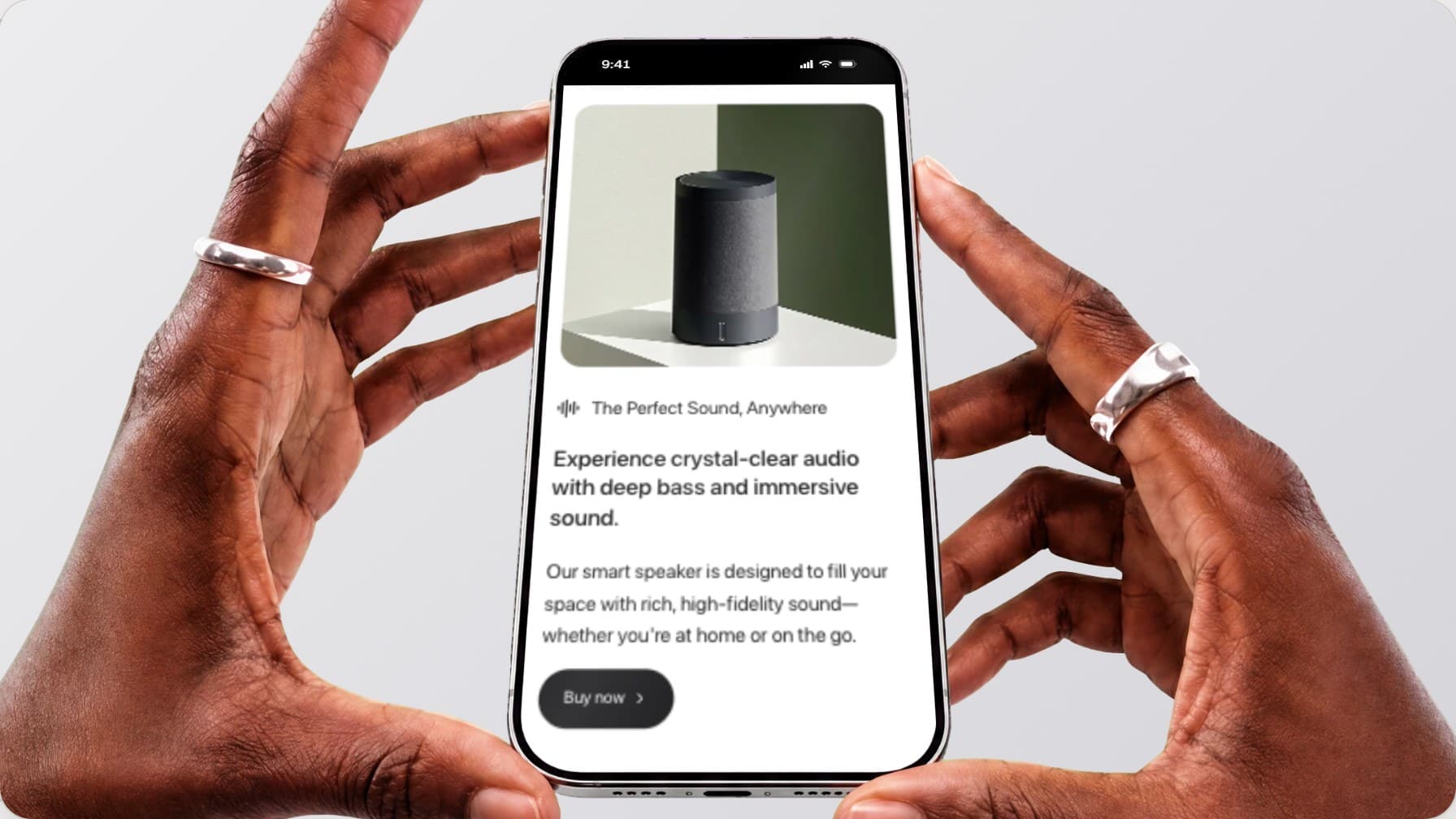 The Two hands scene in the mockup studio, a website on a phone held between two open hands on a light grey background